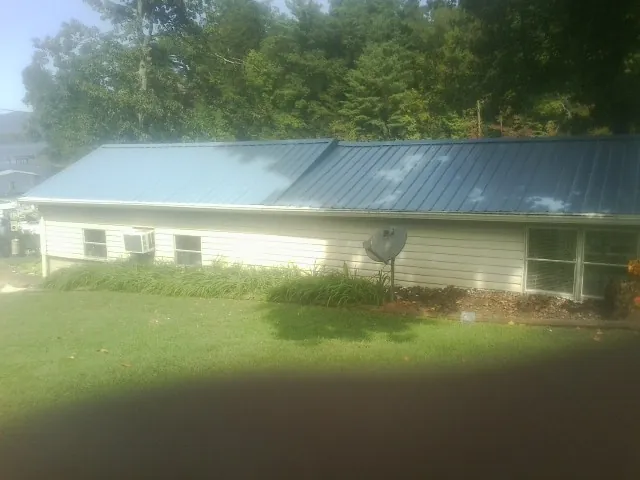 Blue metal roof running the length of a single story home in Clearwater